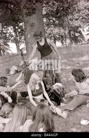 Hippy Festival Windsor Great Park August 1972 Groups of hippies from all over the world camping in the open sheltered by big oak trees and cooking in the bushes Stock Photo