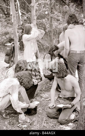 Hippy Festival Windsor Great Park August 1972 Groups of hippies from all over the world camping in the open sheltered by big oak trees and cooking in the bushes Stock Photo