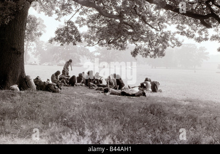 Hippy Festival Windsor Great Park August 1972 Groups of hippies from all over the world camping in the open sheltered by big oak trees and cooking in the bushes Local Caption relaxedimages Stock Photo