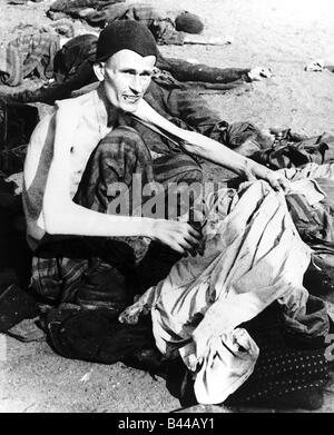 War an emaciated Belsen prisoner after the liberation by allied forces Stock Photo