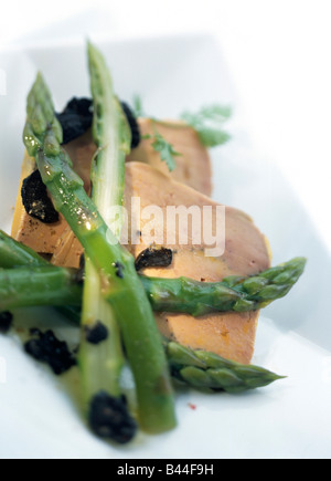 Foie gras terrine with green asparagus and truffles Stock Photo