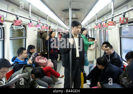 Passengers on a metro in Beijing, China Stock Photo