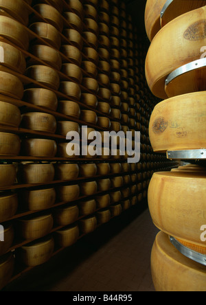 Pile of whole parmesan cheeses Stock Photo