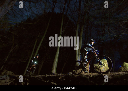 Night time mountain biking in Leigh Woods and Ashton Court, Bristol, UK Stock Photo