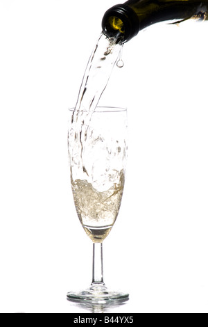 A photo of bubbly being poured into flute glass Stock Photo