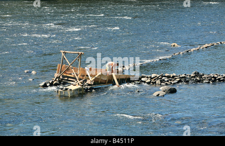 An eel weir on the Delaware River between Pennsylvania An eel man is working on the weir in the middle of the river. Stock Photo