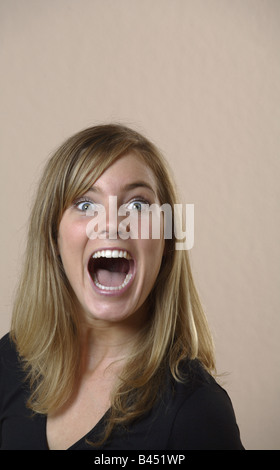 Portrait of a young woman screaming Stock Photo