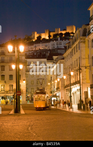 Portugal, Lisbon at night, Rossio square with a tram and the castelo de Sao Jorge castle Stock Photo