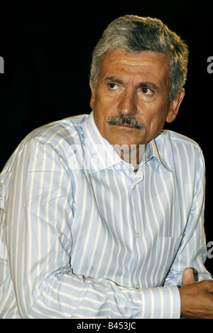 Former italian prime minister and minister of foreing affairs Massimo D'alema talking at a summer conference in non formal dress Stock Photo