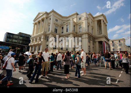 Visitors around Brighton Town Hall in Bartholomews - UK Stock Photo