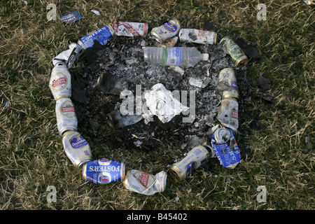 A circle of dead beer cans in the grass marks a fire place on the hill overlooking the Pyramid Stage   Glastonbury Music Festival 2003 Held on 1,000 acre Worthy Farm in Somerset, UK, over three days at the end of June almost every year since 1970, the festival now attracts a capacity crowd of 112,500.  This year festival tickets sold out in 18 hours. Stock Photo