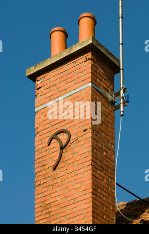 Decorative letter 'P' reinforcing chimney stack, France. Stock Photo