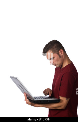 a man uses his laptop computer isolated on white background Stock Photo