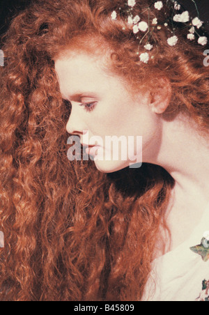Profile of a young, red-haired woman's face Stock Photo