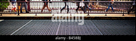 PEOPLE WALKING ON A LA SALLE STREET DRAW BRIDGE OVER CHICAGO RIVER IN DOWNTOWN CHICAGO ILLINOIS USA DOWNTOWN CHICAGO ILLINOIS US Stock Photo