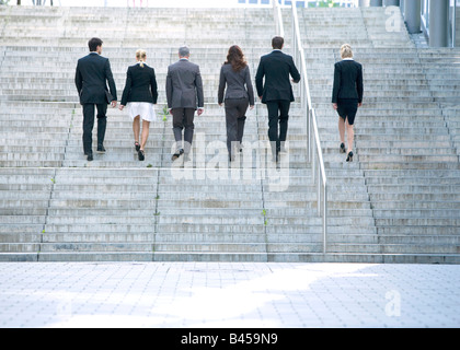 Germany, Baden-Württemberg, Stuttgart, Businesspeople walking steps, rear view Stock Photo