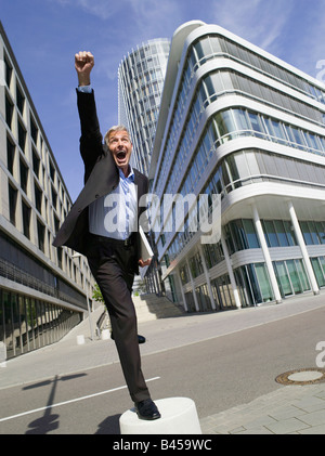 Germany, Baden-Württemberg, Stuttgart, Businessman cheering Stock Photo
