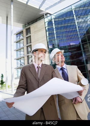 Germany, Baden-Württemberg, Stuttgart, two architects with working plans Stock Photo