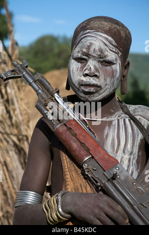 A child holding a Kalashnikov, Mago National Park, Southern Ethiopia, Africa Stock Photo