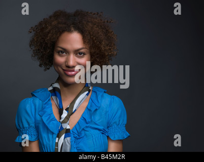 Mixed Race woman wearing scarf around neck Stock Photo