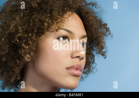 Mixed Race woman with curly hair Stock Photo