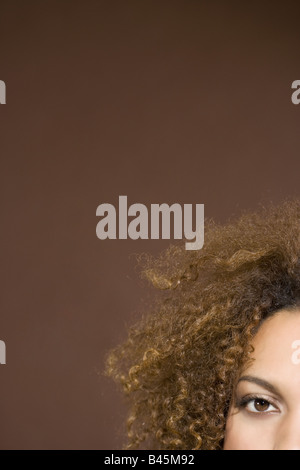 Mixed Race woman with curly hair Stock Photo