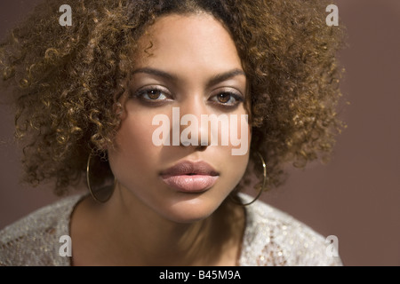 Mixed Race woman with curly hair Stock Photo