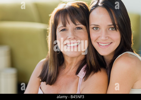 Brazilian mother hugging daughter, hispanic latin people real life
