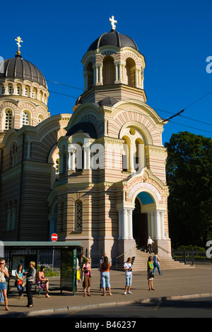 People waiting for public transport in front of Russian Orthodox Cathedral along Brivibas bulv boulevard in Riga Latvia Europe Stock Photo
