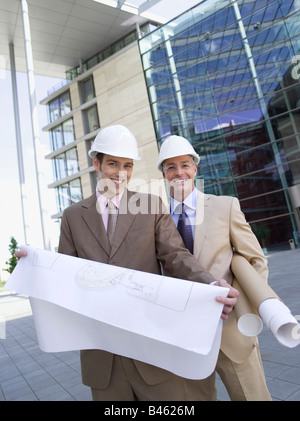 Germany, Baden-Württemberg, Stuttgart, two architects with working plans Stock Photo