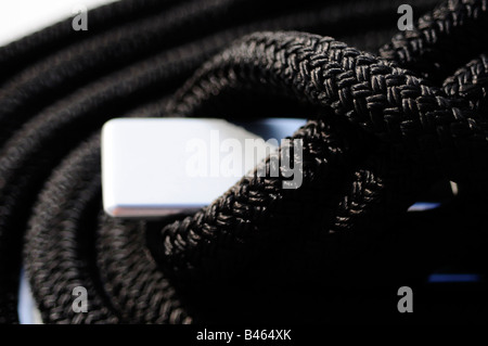 Close up of black rope tied to the deck of a super yacht.  Picture by Patrick Steel patricksteel Stock Photo