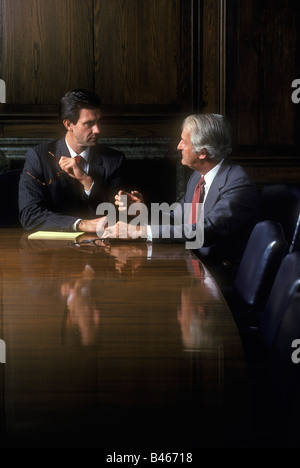 Two executives in a boardroom meeting Stock Photo
