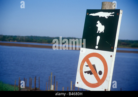 No swimming sign in St Lucia national wetlands National Park, South Africa. Stock Photo