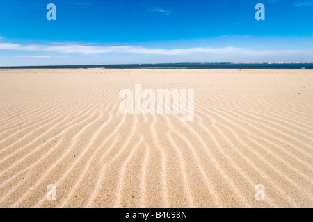 textured sand grooves and summer blue sky Stock Photo