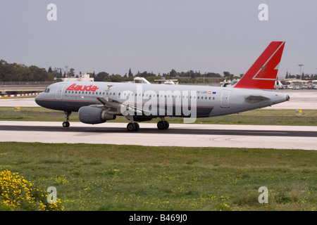 Lauda Airbus A320 taking off from Malta. Lauda Air ceased operations in 2013. Stock Photo