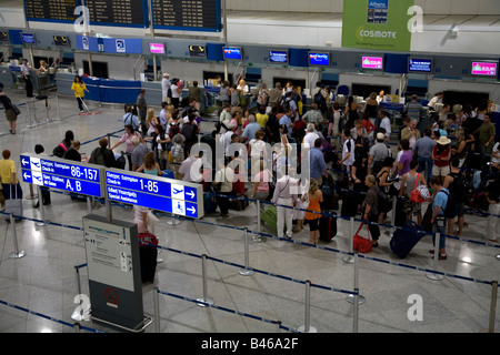 People Queuiing and Checking in at Athens Airport Greece Stock Photo