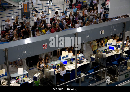 People Queuiing and Checking in at Athens Airport Greece Stock Photo