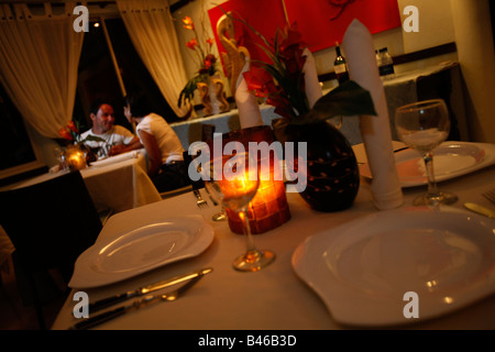 Latin couple on a date at a fine dinging restaurant Stock Photo