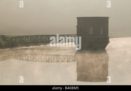 The Pump Control Tower of Talybont Reservoir in the Brecon Beacons Wales in early morning mist