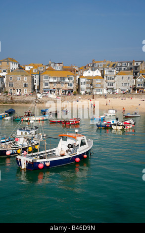 Colourful boats and the harbour beach on a sunny day in St. Ives, Cornwall UK. Stock Photo