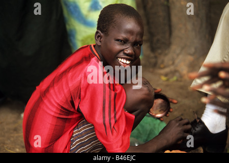 A young shoe shiner in Africa Stock Photo