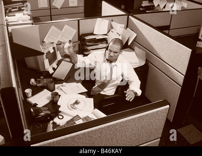 Businessman in Office Cubicle Stock Photo