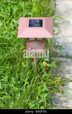 A solar powered garden lamp these save electricity and are very eco friendly Stock Photo