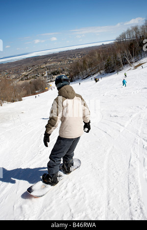 Ski skiing and snowboarding Lone young male snowboarder in black