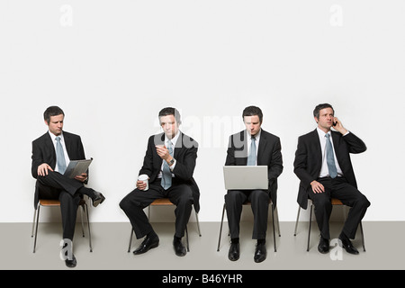 Businessmen with different objects Stock Photo