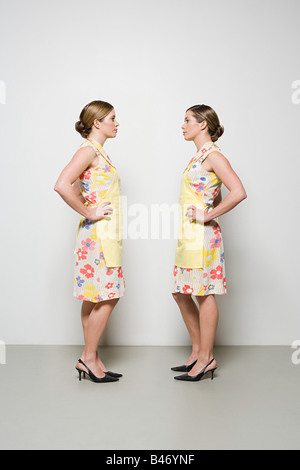 Women facing each other Stock Photo