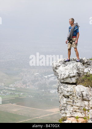 Man standing on a rock Stock Photo