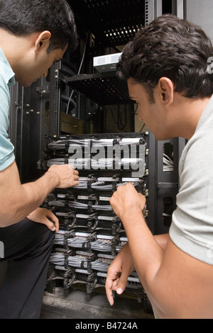 Two computer technicians working on server Stock Photo