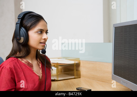 Indian woman working in a call centre Stock Photo