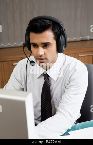 Indian man working in a call centre Stock Photo
